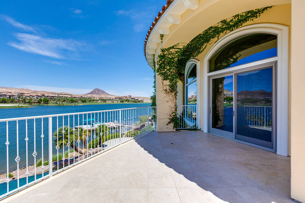 The upstairs, suite-sized master bedroom has a balcony with views of Lake Las Vegas. (Ivan Sher ...