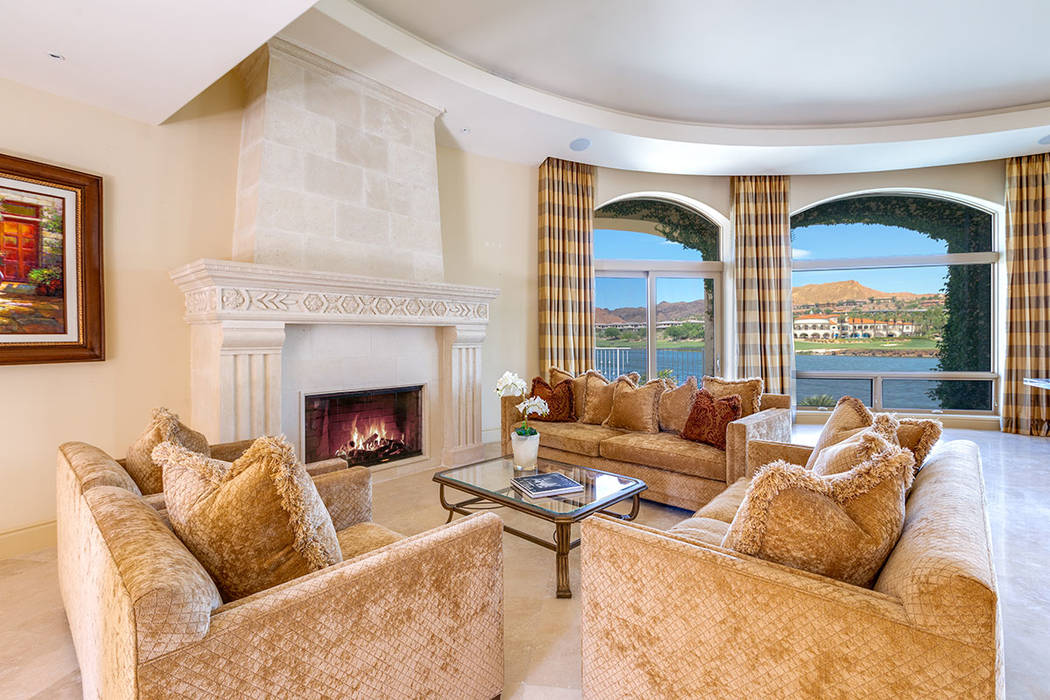 The living room features a traditional fireplace. (Ivan Sher Group)