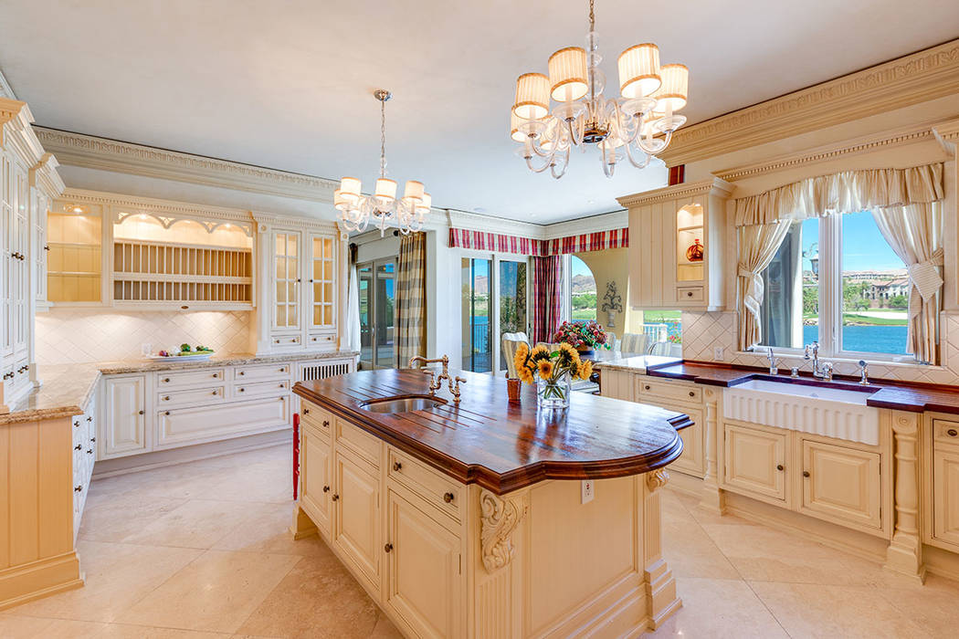 The kitchen features Christians custom cabinetry and mahogany countertops. (Ivan Sher Group)