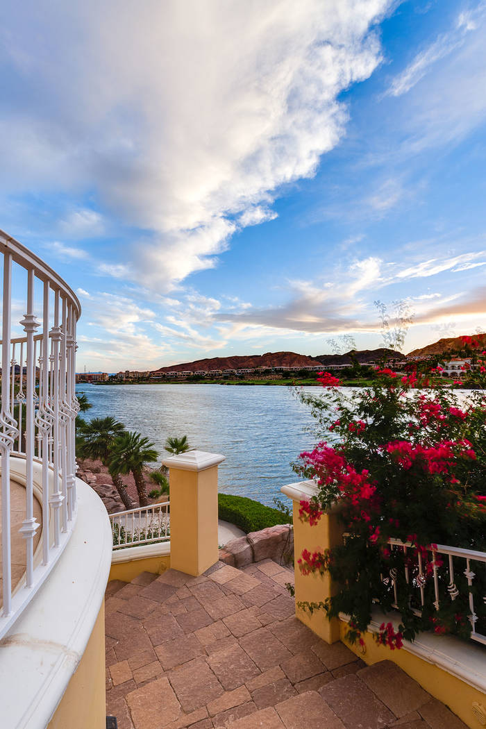 A stone staircase that’s lined with palms and bougainvillea leads from the home to the dock. ...