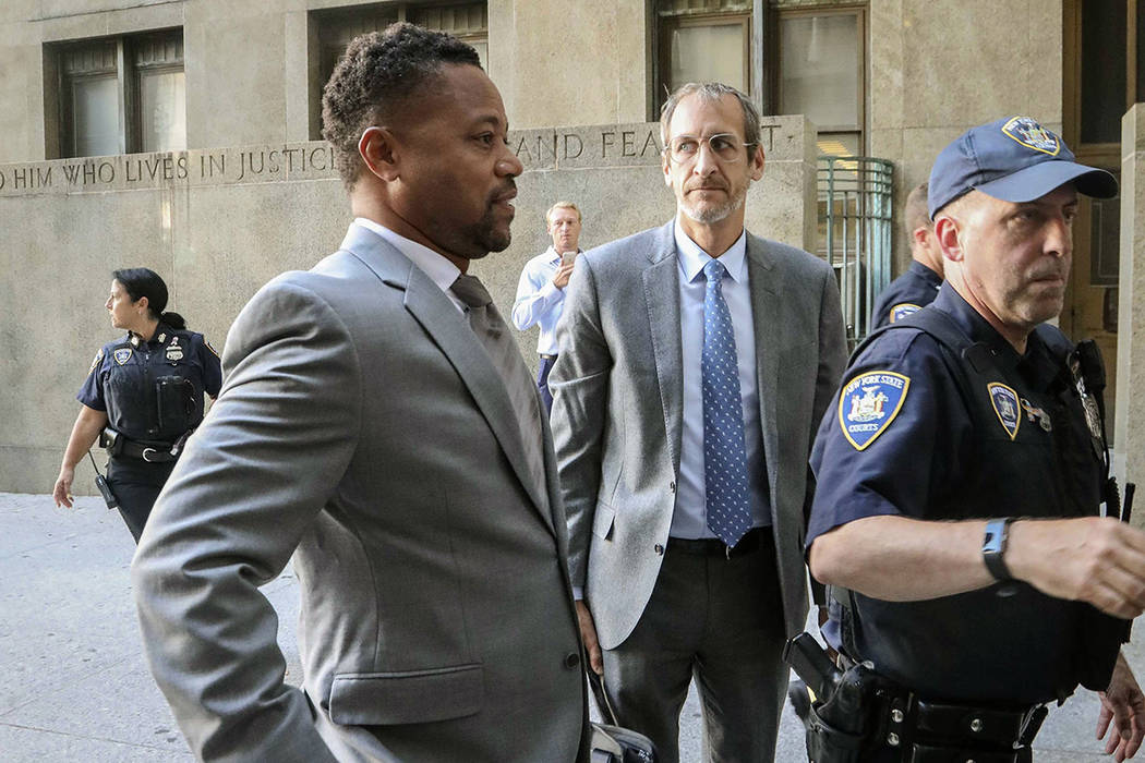 Cuba Gooding, Jr., left, arrives at court to face a groping allegation charge, Tuesday Sept. 3, ...