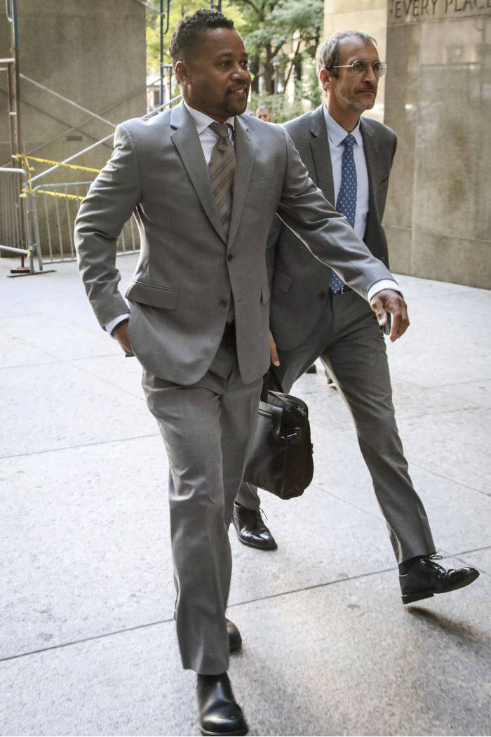 Cuba Gooding, Jr. left, arrives at court as he faces a groping allegation charge, Tuesday, Sept ...