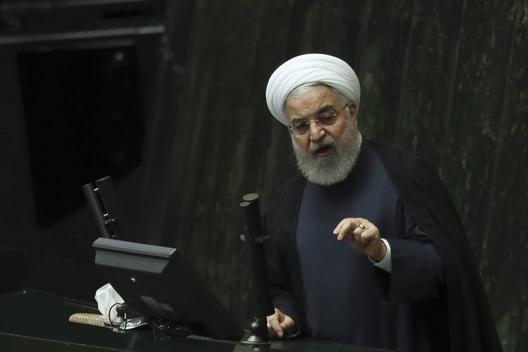 Iranian President Hassan Rouhani speaks at a session of parliament to debate his proposed touri ...