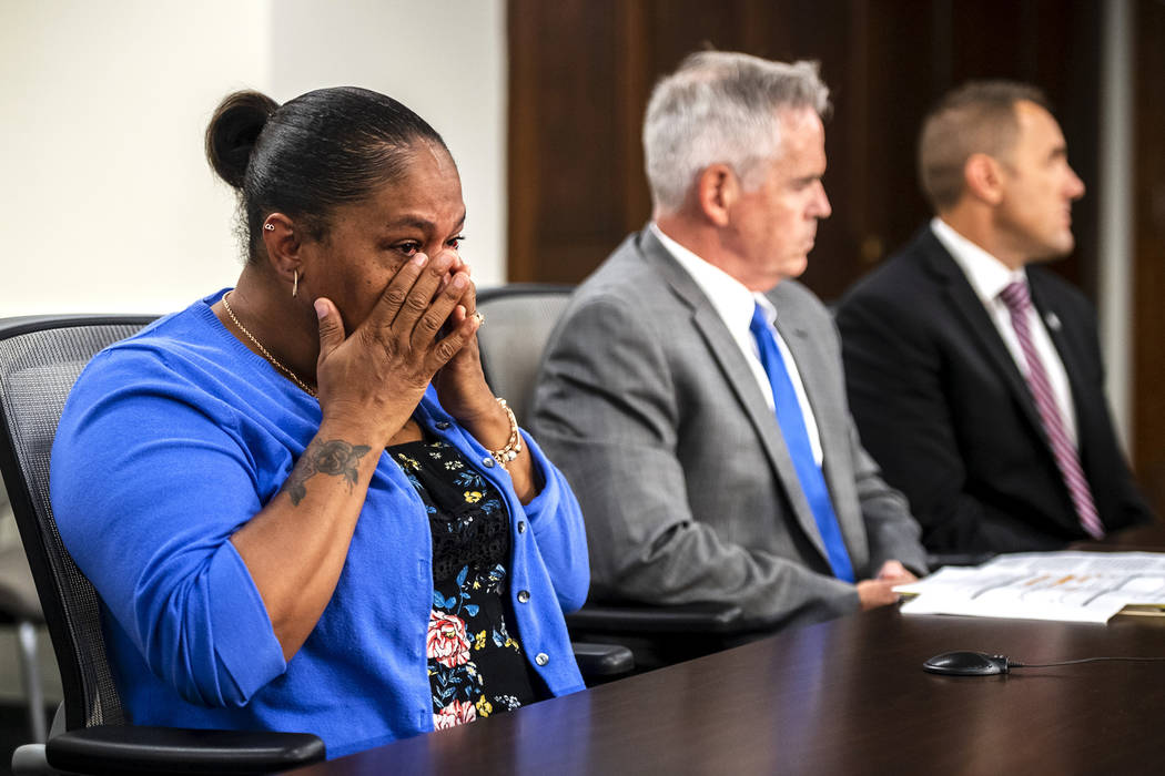 Taji Walsh, Nalani Johnson's grandmother, left, wipes away tears as Coleman McDonough, county p ...