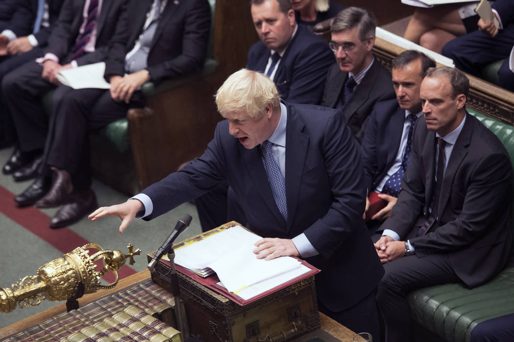 In this handout photo provided by the House of Commons, Britain's Prime Minister Boris Johnson ...