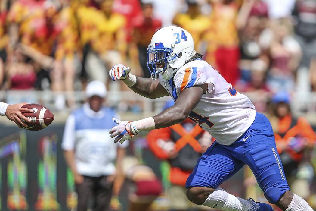 Boise State running back Robert Mahone (34) takes a hand-off for what will be the game-winning ...