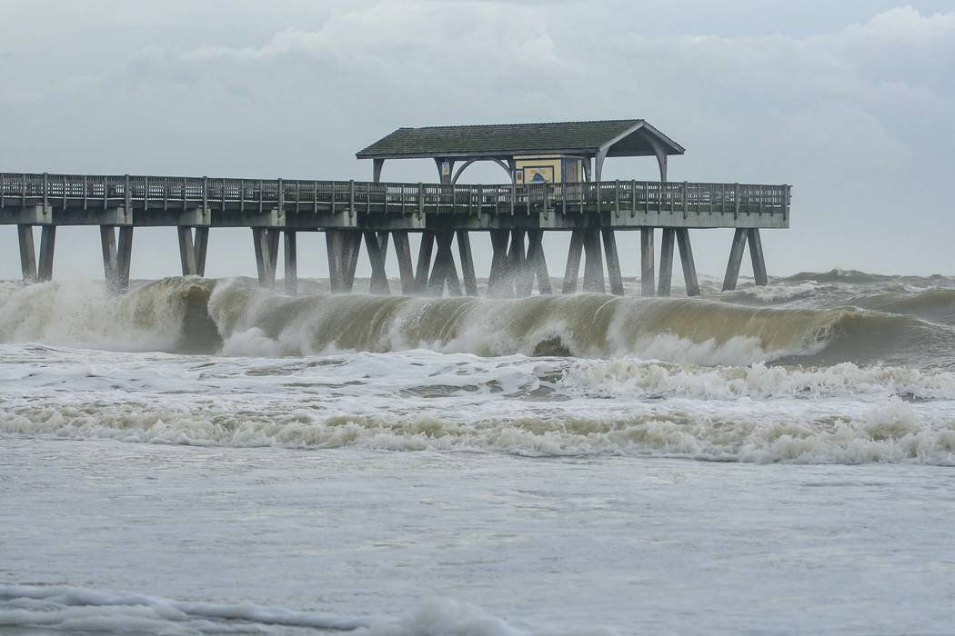 Large waves crashed onto the beach of Tybee Island, Ga., Wednesday, Sept. 4, 2019 as Hurricane ...