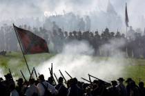 In this June 29, 2013 file photo, Confederate re-enactors take part in a demonstration of a bat ...