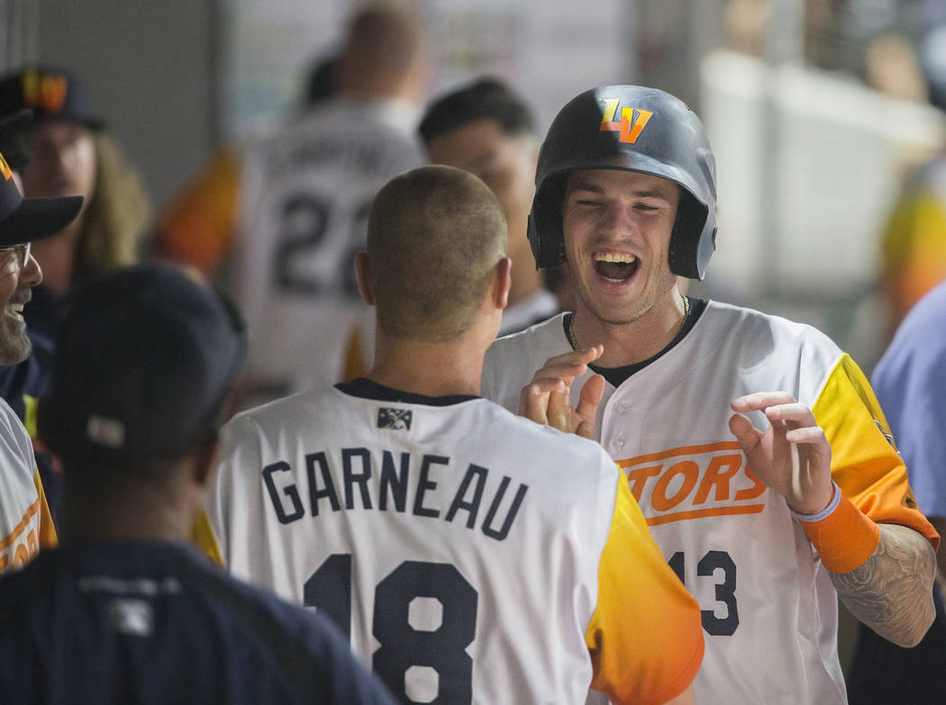 Las Vegas Aviators catcher Jonah Heim (13) celebrates with teammate Las Vegas Aviators catcher ...