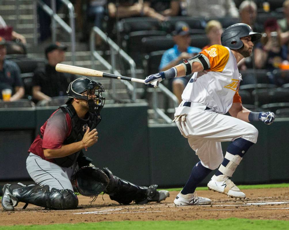 Las Vegas Aviators center fielder Dustin Fowler (10) singles in the bottom of the first inning ...