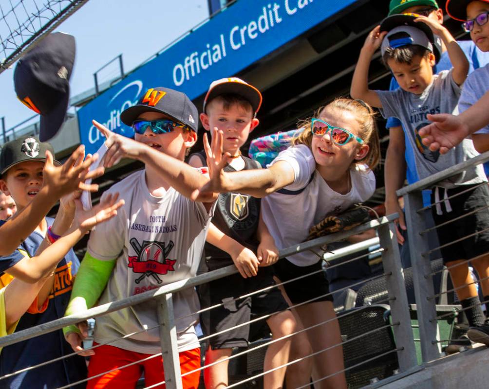 Las Vegas Aviators fans eye a hat tossed to them by a player below following a loss to the Sacr ...