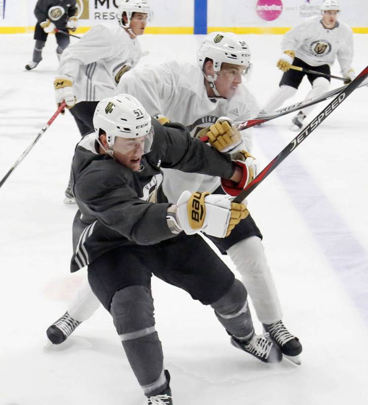 Vegas Golden Knights prospects Ben Jones, left, and Jimmy Schuldt collide during scrimmage at G ...