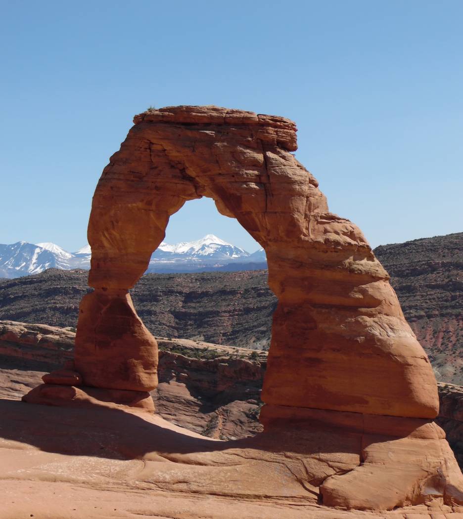 The 65-foot Delicate Arch, represented on Utah license plates, is visible at Arches National Pa ...