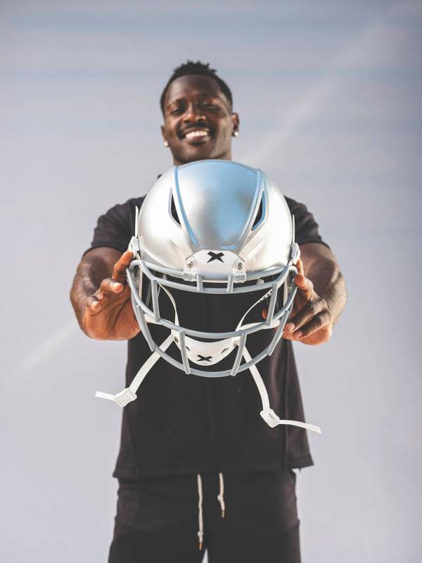 Raiders wide receiver Antonio Brown displays his new helmet, the Shadow by helmet-maker Xenith. ...