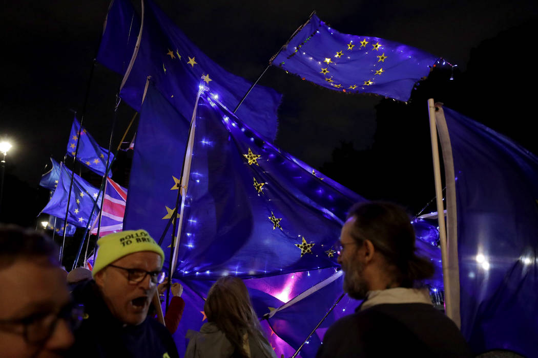 Remain in the EU supporters demonstrate with European flags opposite the Houses of Parliament i ...