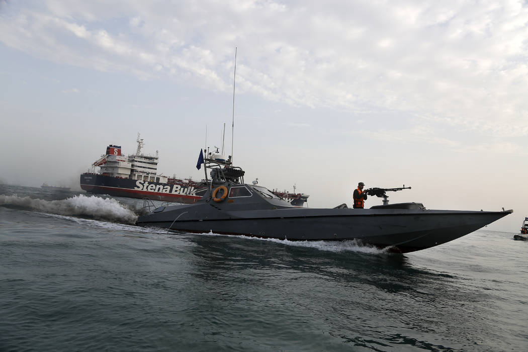 In a July 21, 2019, file photo, a speedboat of the Iran's Revolutionary Guard moves around a Br ...