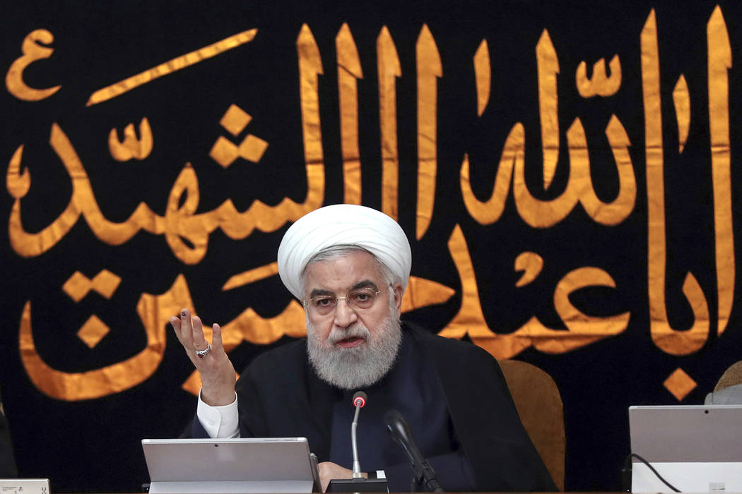 In this photo released by the office of the Iranian Presidency, President Hassan Rouhani speaks ...