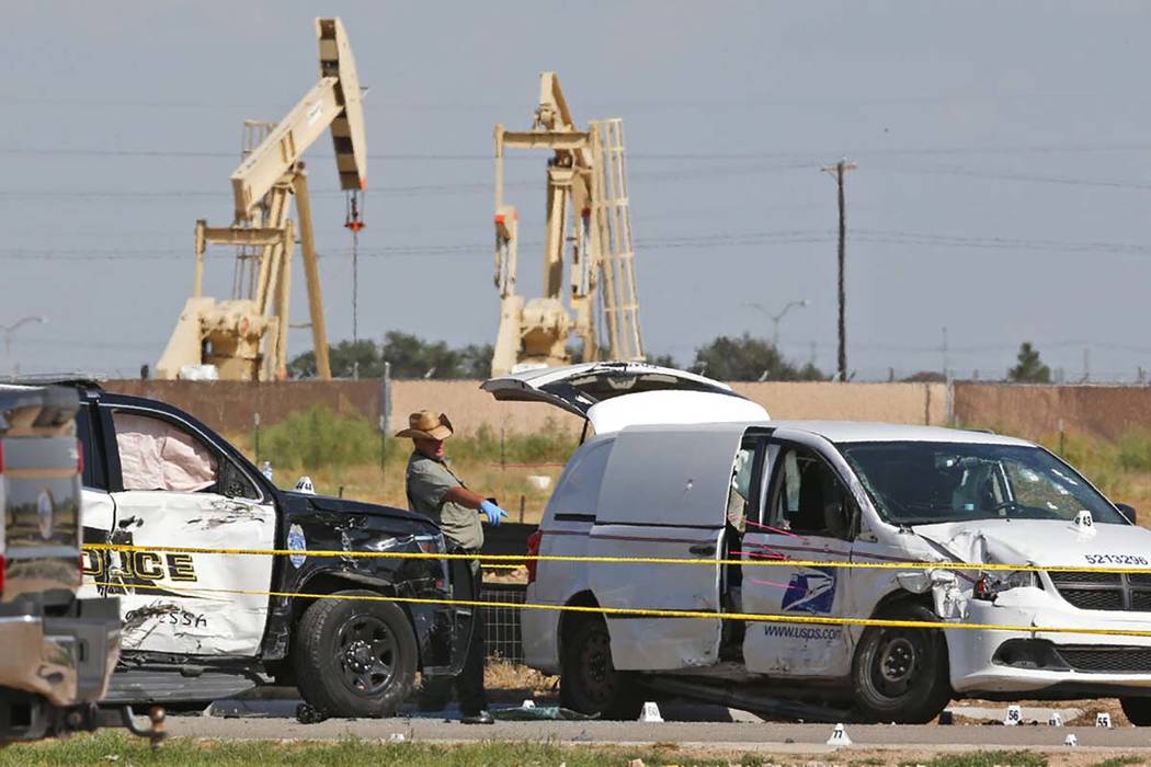 In a Sunday, Sept. 1, 2019, file photo, law enforcement officials process the crime scene from ...