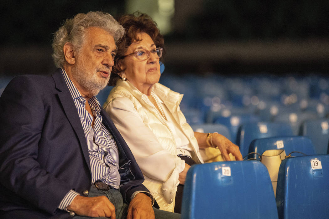 In a Tuesday, Aug. 27, 2019, file photo, Placido Domingo and his wife, Marta, attend a rehearsa ...