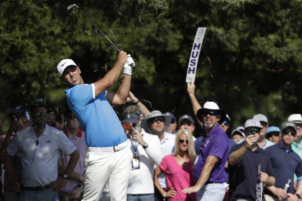 Brooks Koepka kits off the 16th tee during the final round of the World Golf Championships-FedE ...