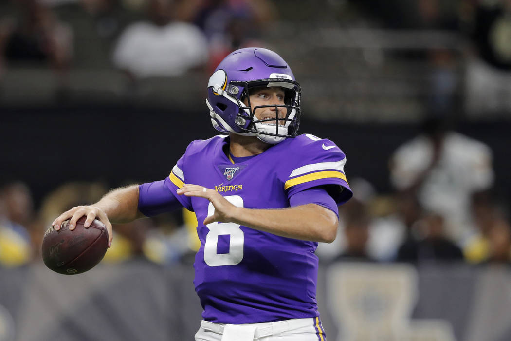 Minnesota Vikings quarterback Kirk Cousins (8) drops back to pass in the first half of an NFL p ...