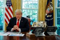 President Donald Trump listens during a briefing on Hurricane Dorian in the Oval Office of the ...