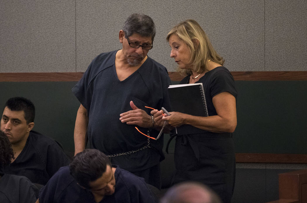 Jose Azucena, left, speaks to Judge Richard Scotti through a Spanish language interpreter durin ...