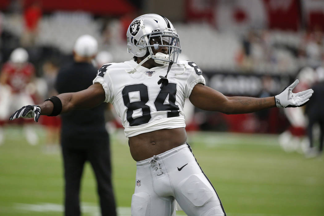 FILE - In this Aug. 15, 2019, file photo, Oakland Raiders wide receiver Antonio Brown (84) warm ...