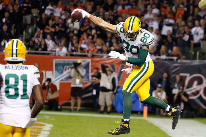 Green Bay Packers' Jimmy Graham reacts after catching a touchdown pass during the first half of ...