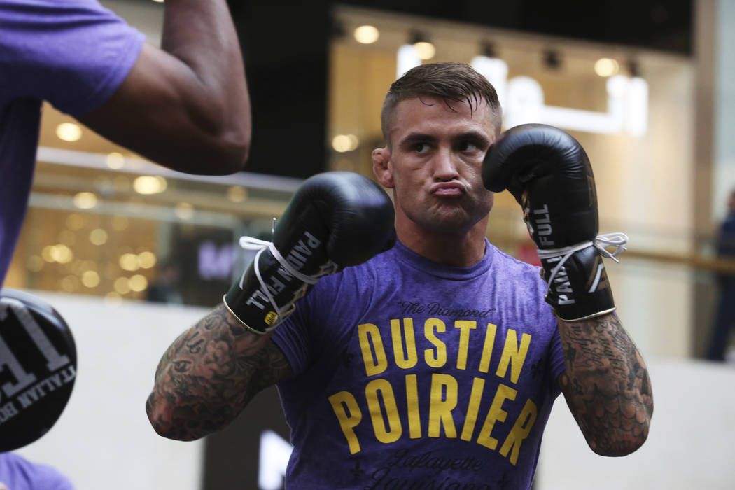 UFC fighter Dustin Poirier of Lafayette, Louisiana, spars with a partner during an open trainin ...