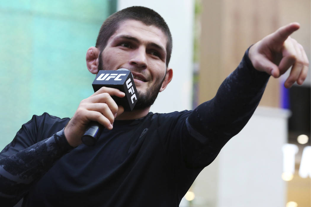 Russian UFC fighter Khabib Nurmagomedov gestures to the crowd during an open training session a ...