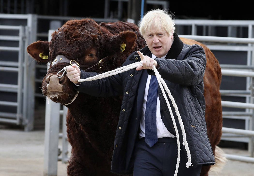 Britain's Prime Minister Boris Johnson visits Darnford Farm in Banchory near Aberdeen, Scotland ...