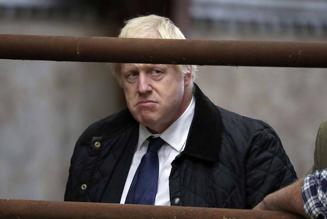 Britain's Prime Minister Boris Johnson visits Darnford Farm in Banchory near Aberdeen, Scotland ...