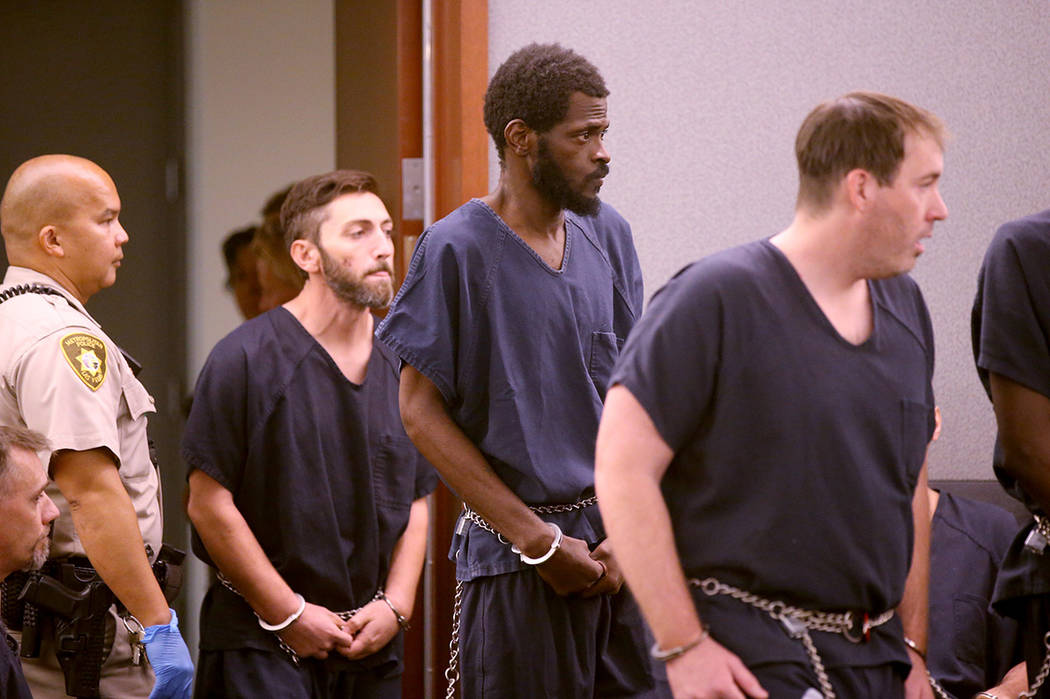Clinton Taylor, center, appears in court at the Regional Justice Center in Las Vegas on Wednesd ...
