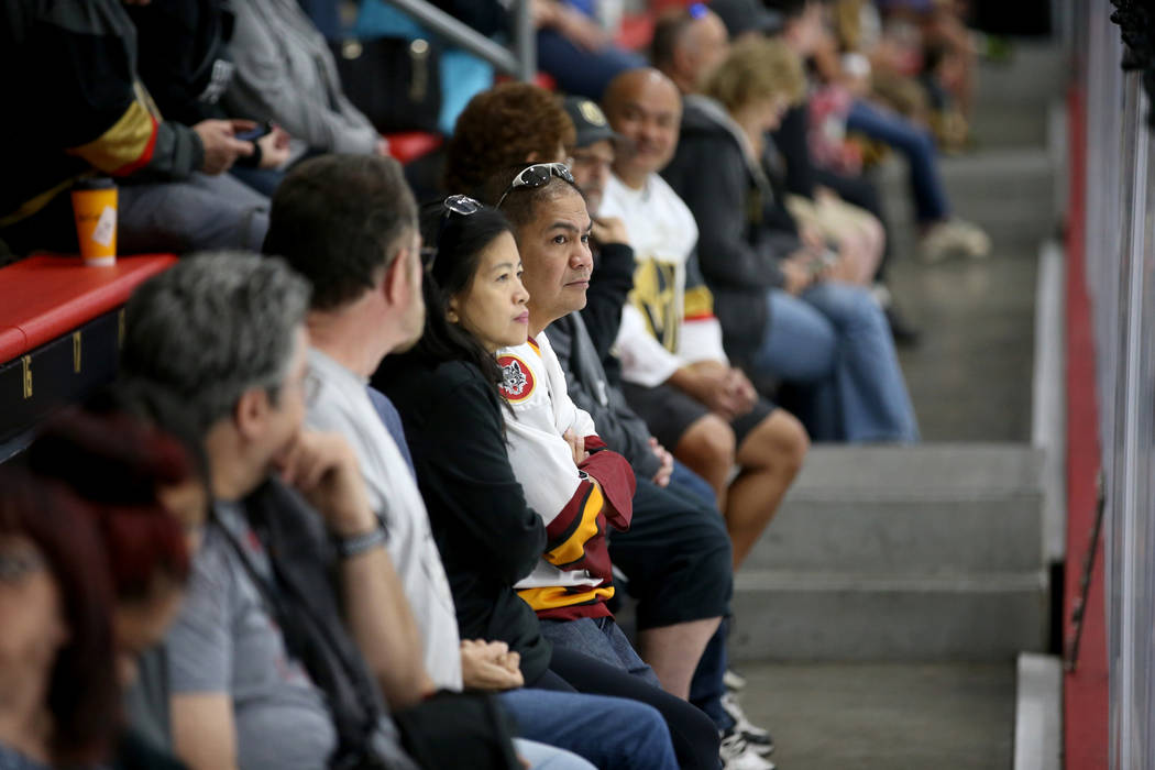 Fans watch players warm up during the Vegas Golden Knights rookie camp at City National Arena i ...