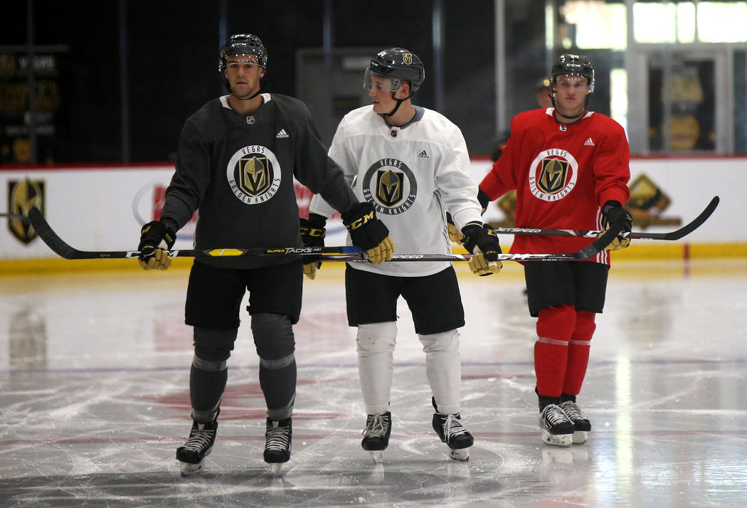 Vegas Golden Knights players, from left, defender Connor Corcoran, forward Ben Jones and forwar ...