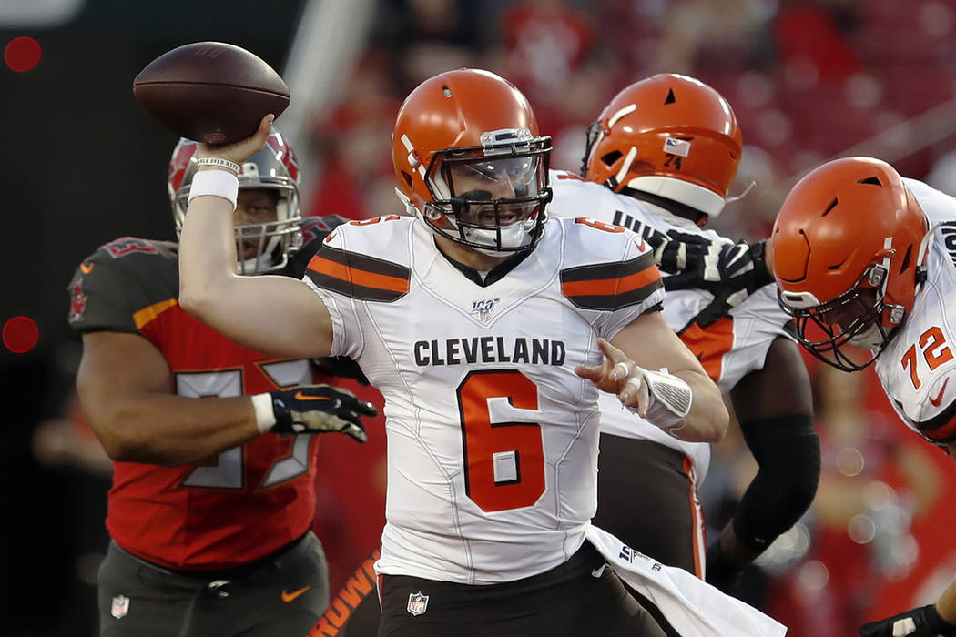 In this Friday, Aug. 23, 2019, file photo, Cleveland Browns quarterback Baker Mayfield (6) thro ...