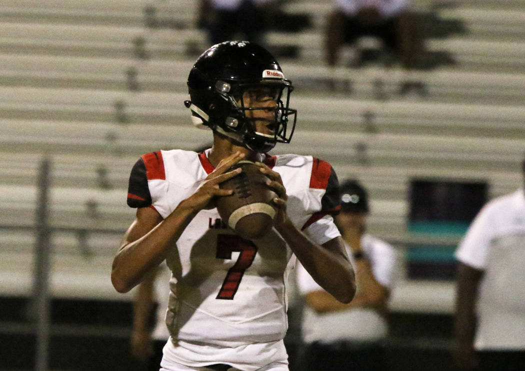 Las Vegas High's quarterback Ja'shawn Scroggins sets up to pass the ball during the first half ...