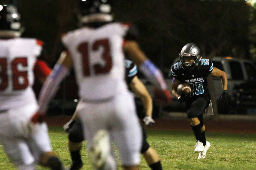 Silverado High's Jeremy Alipio (25) returns punt during the first half of their football game a ...