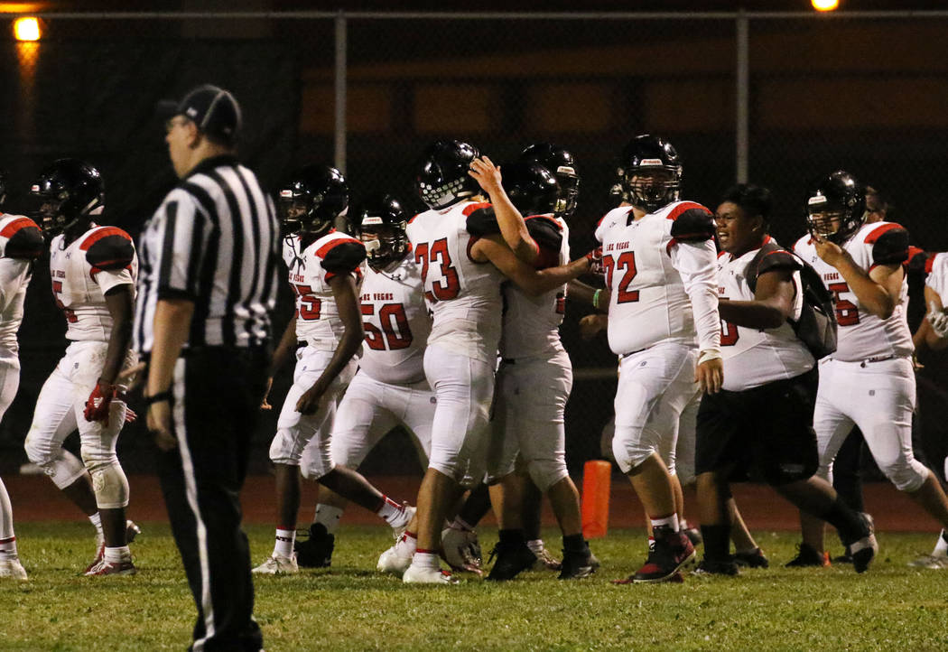 Las Vegas High players celebrate their 39-28 win against Silverado High during the second half ...