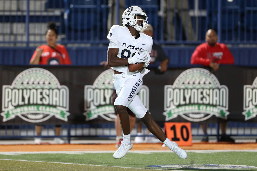 St. John Bosco's Beaux Collins (88) makes a catch for a touchdown against Liberty in the fourth ...