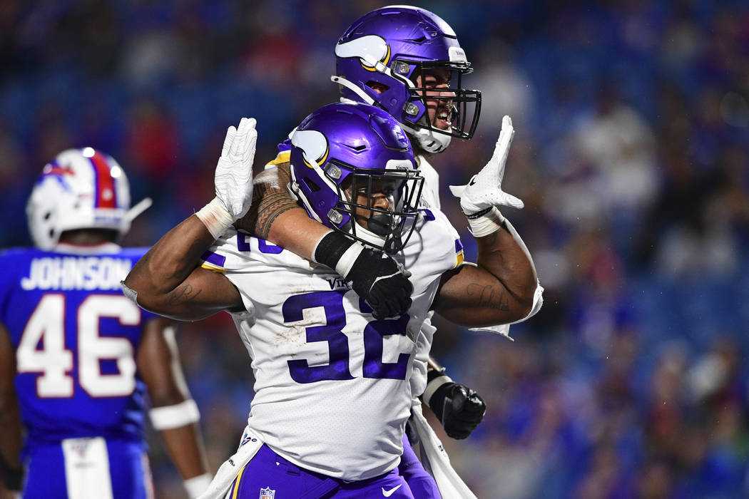 Minnesota Vikings running back De'Angelo Henderson (32) celebrates his touchdown with offensive ...