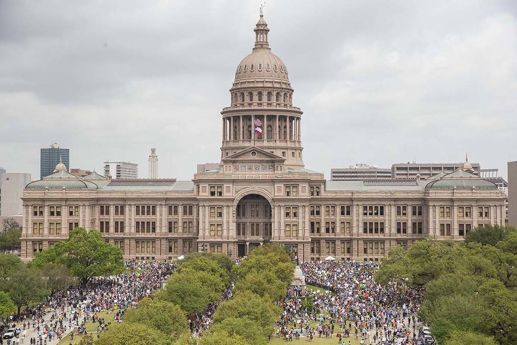 In this March 24, 2018, file photo, thousands of people gather on the grounds of the Texas Stat ...