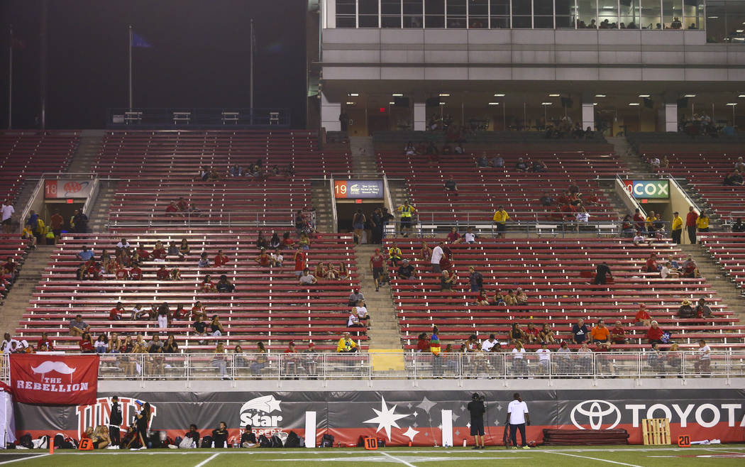 UNLV Rebels fans leave the game during the second half of an NCAA football game against the Ark ...