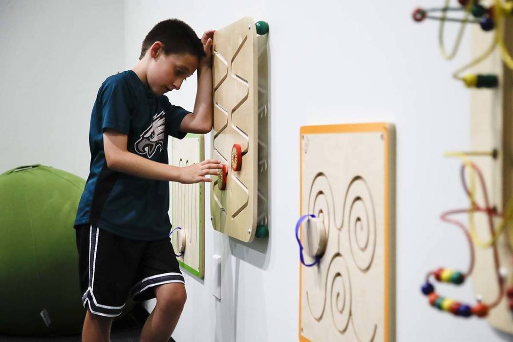 In this Thursday, Aug. 22, 2019, photo, 10-year-old Jack Ykoruk plays in the Lincoln Financial ...