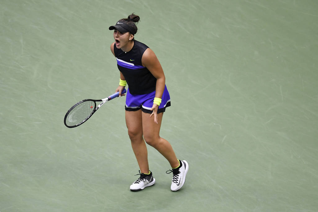 Bianca Andreescu, of Canada, reacts after scoring a point against Serena Williams, of the Unite ...