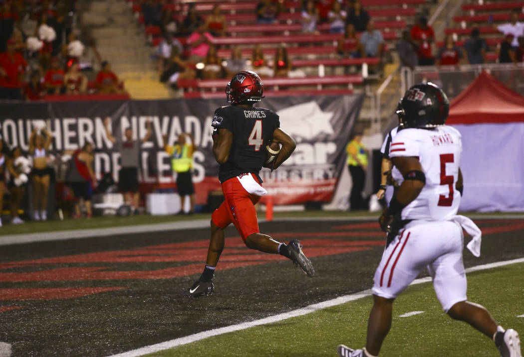 UNLV Rebels wide receiver Randal Grimes scores a touchdown against the Arkansas State Red Wolve ...