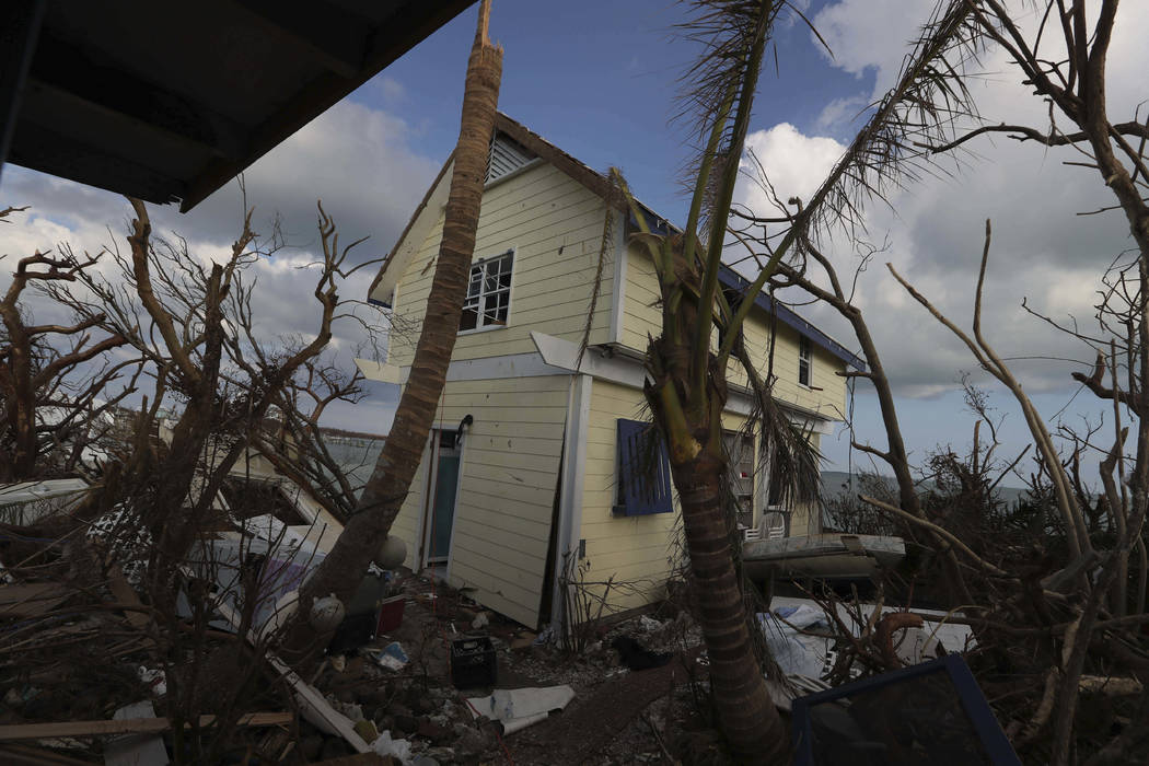 A home damaged by Hurricane Dorian is surrounded by debris in Eastern Shores just outside of Ma ...