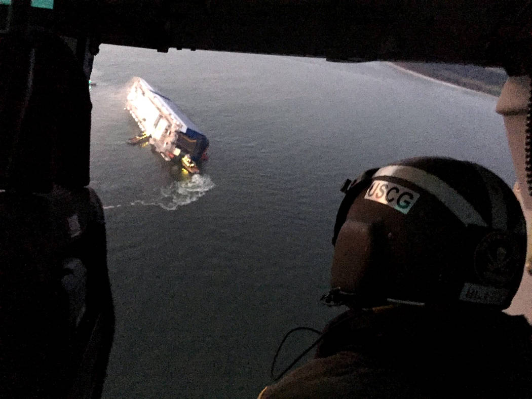 Coast Guard crews and port partners respond to a disabled cargo vessel with a fire on board Sun ...