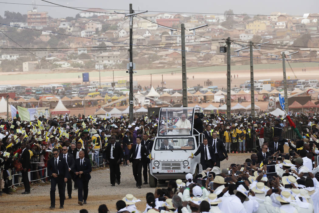 Pope Francis arrives with the popemobile to celebrate a mass in Antananarivo, Madagascar, Sunda ...